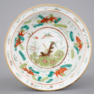 A Chinese polychrome bowl decorated with butterflies and fish, 19th C.