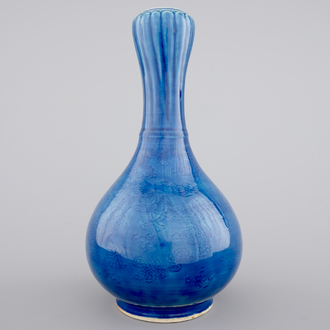 A Chinese monochrome blue garlic vase with incised dragon decoration, 19th C