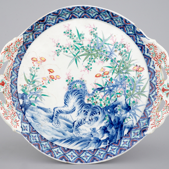 A Japanese porcelain dish decorated with a tiger, 19th C