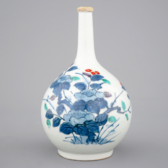A Japanese bottle vase with polychrome floral decoration, 17/18th C.