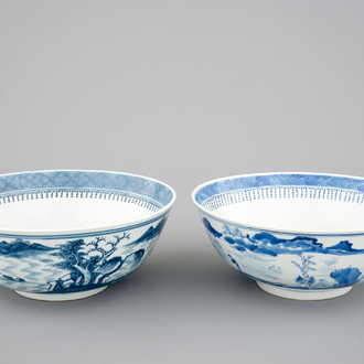 A pair of Chinese blue and white bowls decorated with landscapes, 19th C