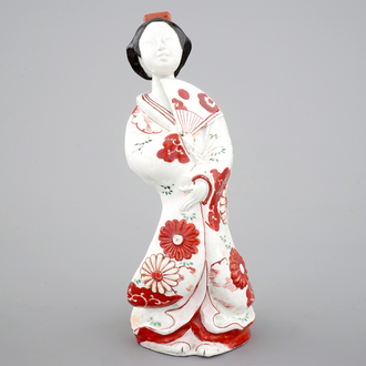 A Japanese porcelain figure of a bijin, 17/18th C.