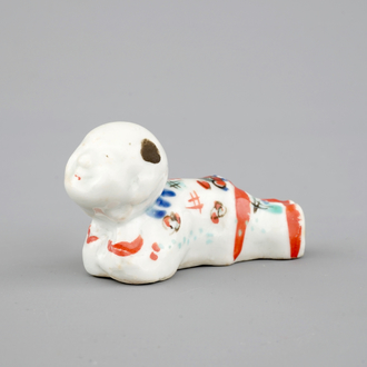 A Japanese kakiemon style whistle in the shape of a boy, 17/18th C