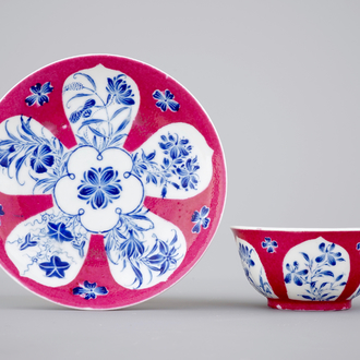 An unusual Chinese ruby ground and overglaze blue cup and saucer, Yongzheng, 1722-1735