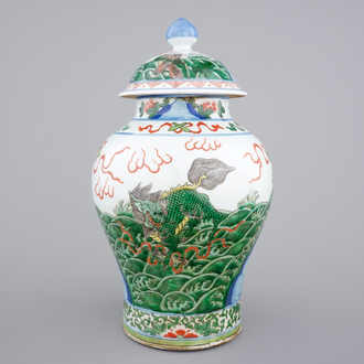 A Chinese wucai porcelain baluster vase with cover, 19th C.