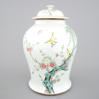 A Chinese famille rose vase and cover with birds on a branch, 19th C.