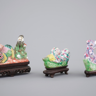 Three Chinese brush rests on wooden stands, 18th C.
