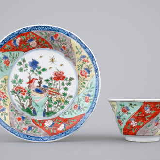 A Chinese famille verte porcelaine moulded cup and saucer, Kangxi, ca. 1700