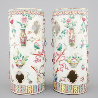 A pair of Chinese famille rose porcelain relief-moulded hat stands, 19th C.