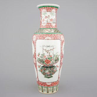 A fine Chinese famille verte and iron red porcelain vase with flowers in a basket, 19th C.