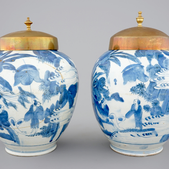 A pair of blue and white Japanese porcelain vases with brass covers in Chinese transitional style, Edo, 17th C.