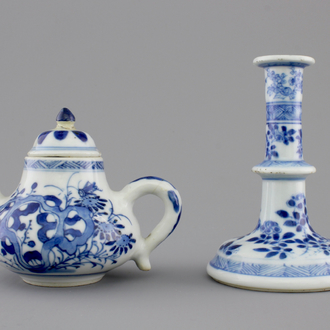 A Chinese blue and white porcelain candlestick and a miniature teapot, 18th C.