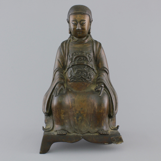 A Chinese bronze figure of an emperor on a throne, 18/19th C.