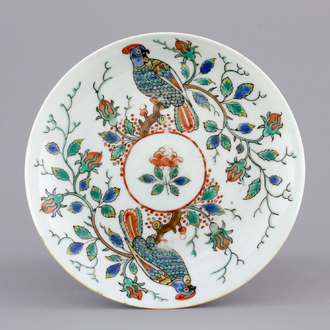 A Dutch-decorated Chinese porcelain saucer plate with parrots, 18th C.