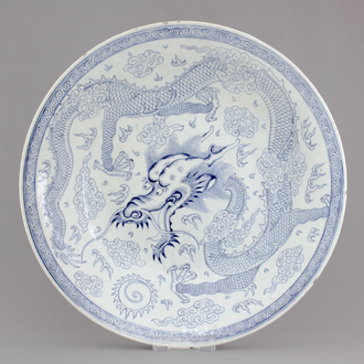 An attractive large blue and white Chinese porcelain dish with a dragon, 19th C.