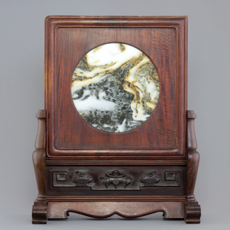 A Chinese dream stone plaque in a carved hardwood stand, 19/20th C.
