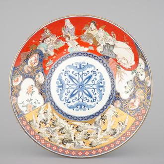 A large Japanese Koransha Fukagawa porcelain charger depicting the Seven Gods of Fortune and a swarm of cranes, late 19th C.