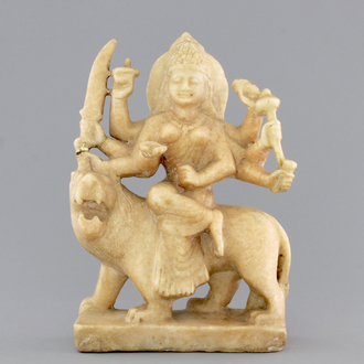 An Indian carved alabaster group of the goddess Durga on her lion "Vahana", 19th C.
