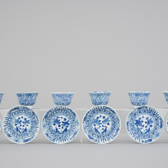 A set of six Chinese blue and white cups and saucers with fish, 19th C.