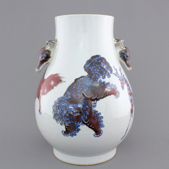 A Chinese hu-shaped deer-handled underglaze red and blue vase with finely painted animals, ca 1900