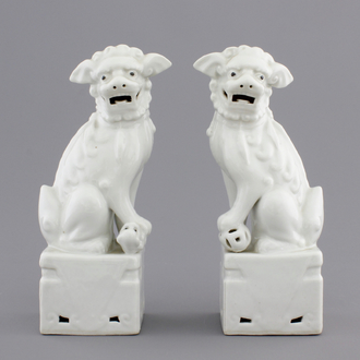 A pair of Chinese Dehua blanc de Chine figures of foo dogs or guardian lions, 19/20th