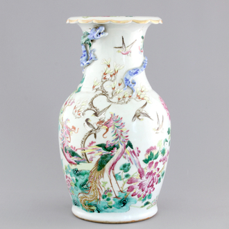 A Chinese porcelain famille rose vase with dragons, 19th C.