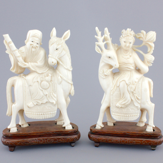 Two carved ivory figures of Chinese immortals on deers, ca. 1920