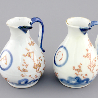 A pair of Japanese Arita porcelain oil and vinegar jugs, 18th C.