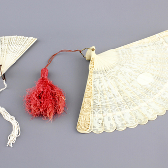 Two Chinese Canton carved and pierced ivory fans, 19th C.