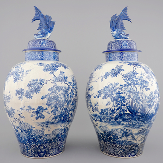 A tall pair of Japanese Arita porcelain blue and white vases and covers, ca. 1860