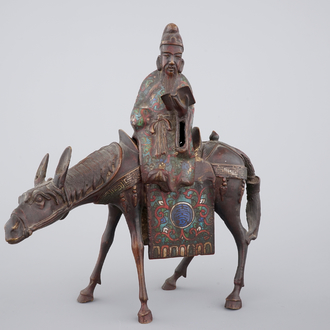 A Japanese champlevé enamel and bronze figure of a sage riding a donkey, 19th C.
