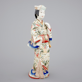 A tall Japanese Arita porcelain model of a “courtesan”, 17/18th C.