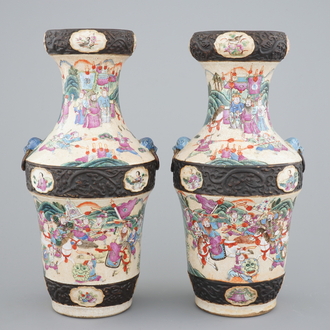 A pair of Chinese Nanking famille rose vases with warrior scenes, 19th C.