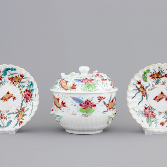 A Chinese famille rose and relief box and cover and two saucers with fish, Yongzheng, 1722-1735