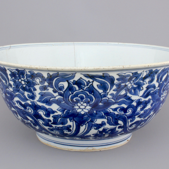 A large blue and white Chinese porcelain bowl with lotus scrolls, Kangxi, ca. 1680