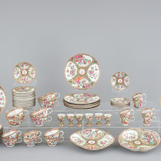 A 62-piece Chinese Canton rose medallion armorial 6-person service of big and small plates, cups and saucers, egg cups and serving trays, 19t C.