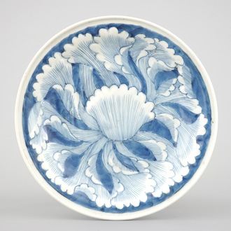 A Japanese Arita porcelain plate with relief-moulded decoration, 18th C.