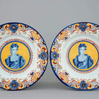 A pair of polychrome Dutch Delft yellow ground portrait plates, 18th C.