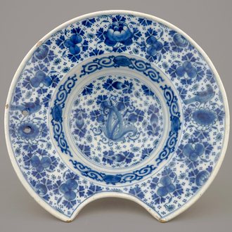 A blue and white Dutch Delft shaving bowl, early 18th C.