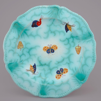 A Brussels faience dish with butterflies and caterpillars, 19th C.