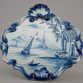 A Dutch Delft blue and white plaque with a sailboat, 18th C.