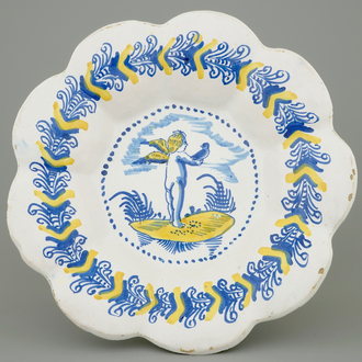 A Haarlem gadrooned dish with a putto as falconer, 17th C.
