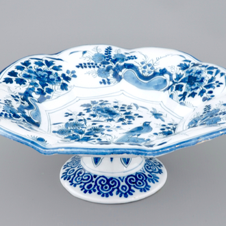 A Dutch Delft blue and white lobed chinoiserie dish on foot, late 17th C.