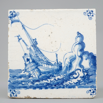 A Dutch Delft tile with a ship near rocks, late 17th C.