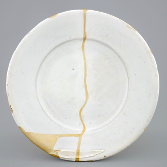 A white Dutch Delft plate with kintsugi style repair, 17th C.