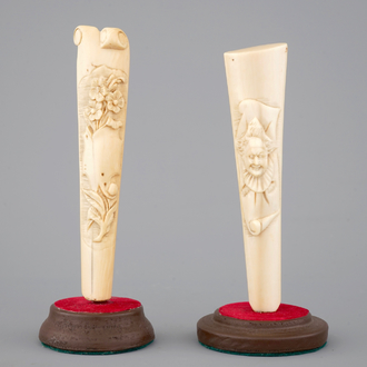 Two carved ivory umbrella or parasol handles, Dieppe (?), 19th C.