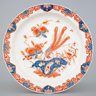 A Dutch Delt doré dish with a peacock, early 18th C.