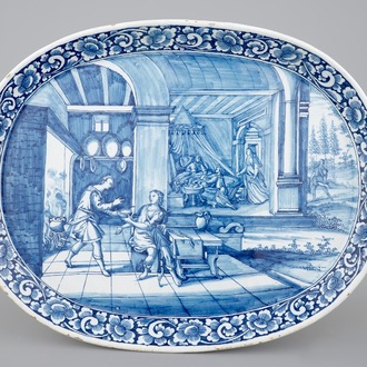 An oval blue and white Dutch Delft serving tray with a biblical scene, 18th C.