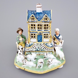 A rare French pottery group with musicians herding sheep by a house, 18th C.