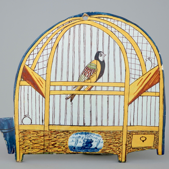 A polychrome Dutch Delft bird cage plaque, 18th C.